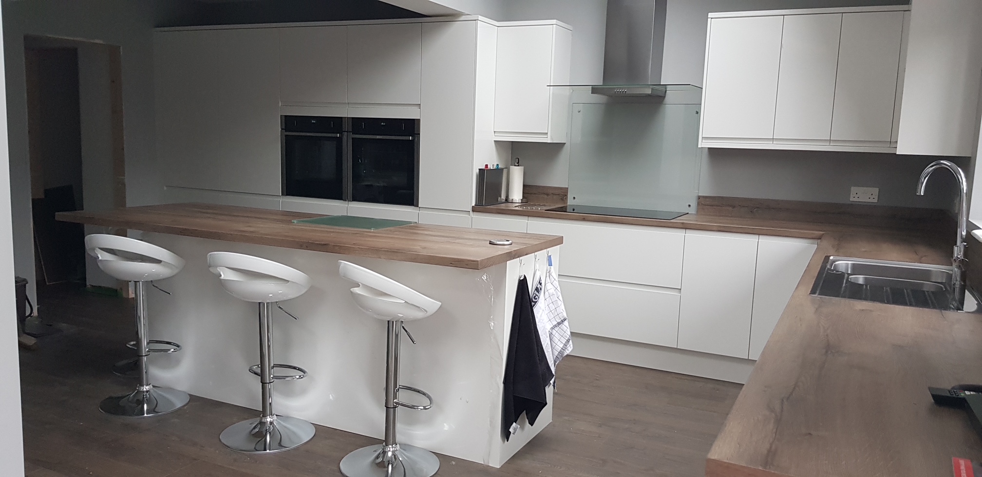Finished kitchen island with double oven and extractor